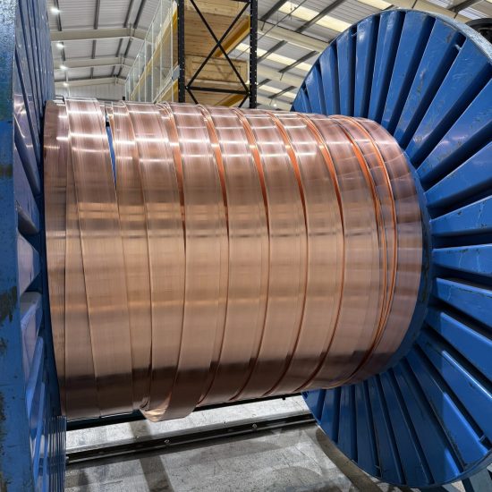 Extruded copper strip wound on a drum