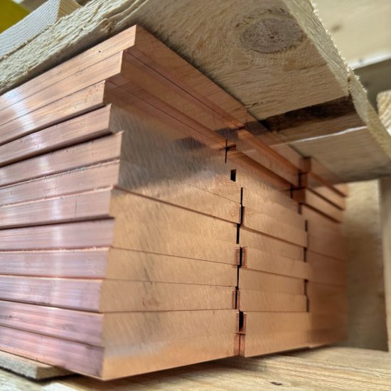 Copper flat bar stock on racking