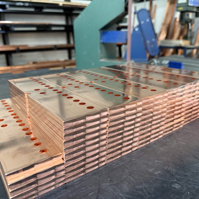 Stacks of punched copper busbars
